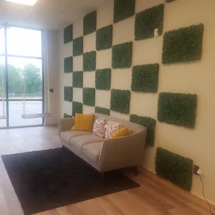 a living room with a couch and a large window