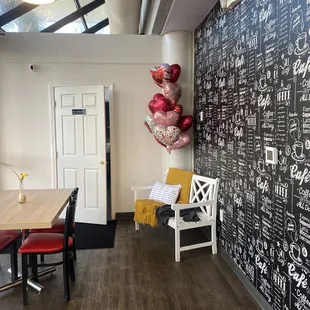 a chalkboard wall with balloons