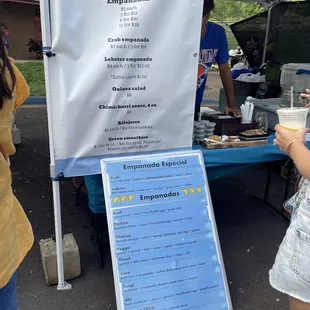 a woman holding a hot dog