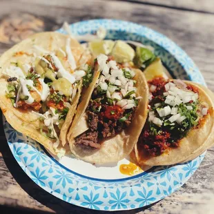 Shrimp taco, al pastor taco, carne asada taco