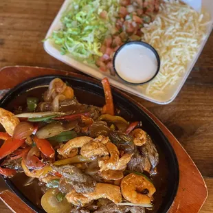 Fajita Mixto: steak, chicken, &amp; shrimp w/fajita peppers &amp; onions, toppings &amp; tortillas!