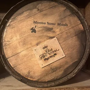 a wooden barrel on a shelf