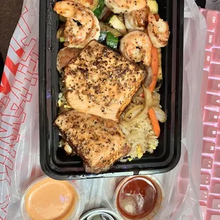 salmon plate with shrimp, with what i believe are sweet chili sauce, eel sauce, and spicy mayo dipping sauces, yum
