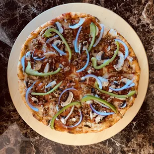 supreme pizza with mozzarella, pepperoni, sausage, peppers, mushroom, onion &amp; green pepper.