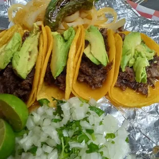 5 mini tacos that includes charro beans