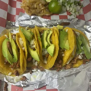 Asada mini tacos with cheese and avocado + beans