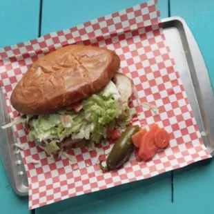 Torta- asada, lettuce, tomato, sour cream, avocado, cheese and ham