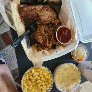 Brisket and pulled pork with mashed potatoes and Mac and cheese.