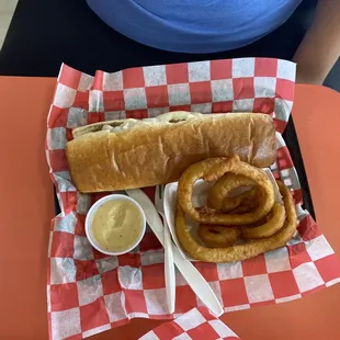 a hot dog and onion rings