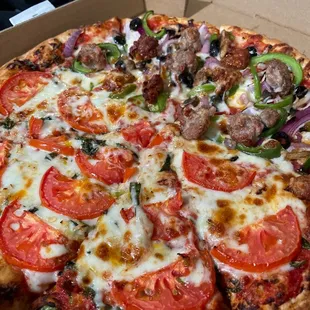 Half medium of the #3. Combination Pizza and #21. Pizza Margherita