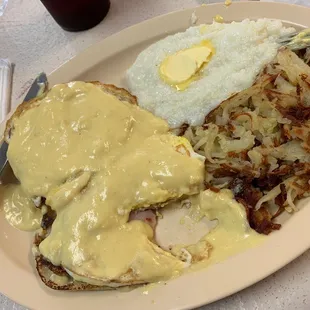 Eggs Benedict with hashed browns and grits! Yum!!!