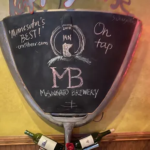 a wine rack with bottles