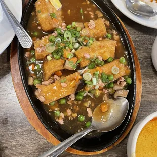 Sizzling tofu! It&apos;s very good! Melts in your mouth.