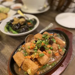 SM27.  Sizzling tofu ($12) - piping hot pockets of tofu and sauce!