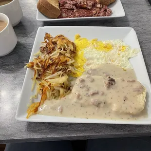 Biscuits &amp; Gravy with hash browns and fried eggs.