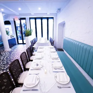 a long table set with place settings