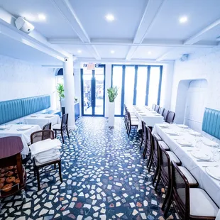 a dining room with tables and chairs