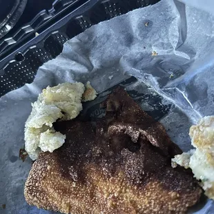 Photo without flash. Burnt hush egg rolls and raw hush puppy batter.