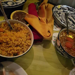 Sides of barracho beans and red rice