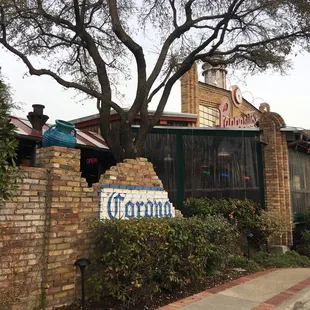 a brick building with a sign on it