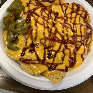 Pulled Meat Nachos (standard chips, stand cheese out of a can, meat I&apos;m sure was smoked on the grill outside :)  with &quot;sweet bbq sauce&quot;