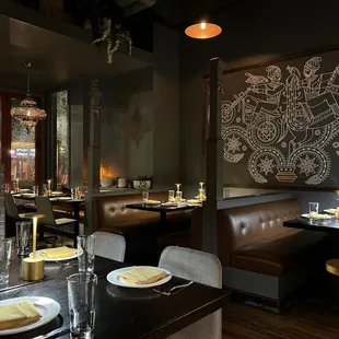a dining area with tables and chairs