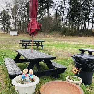 a picnic table with an umbrella