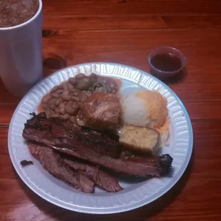 Brisket, ribs, jalapeño beans, cornbread, and mashed potatoes.