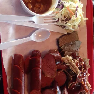 A "Big Hog" plate with 4 meats. Sliced brisket, pulled pork, hot sausage, and polish sausage!! $15