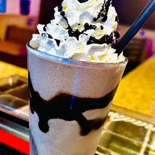 a milkshake with whipped cream and chocolate