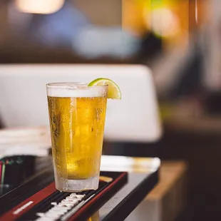 a glass of beer on a table