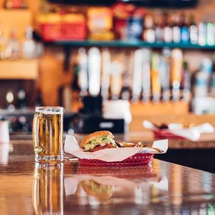 a glass of beer and a sandwich