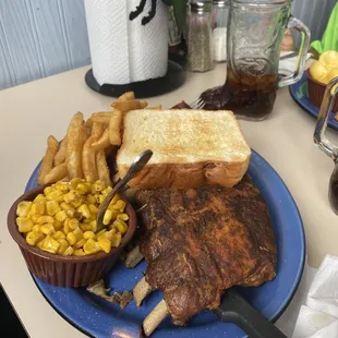 1/2 rack ribs with fried sweet corn, fries, and Texas toast. And root beer in a boot mug!