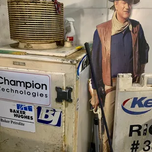 Life Size Duke, next to an ice box, with a cooler on top