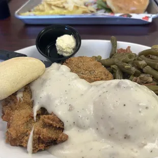 Country fried steak, mashed potatoes and green beans