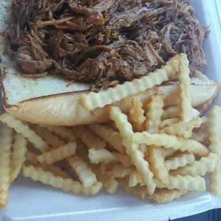 Delicious and juicy Italian beef sandwich ND perfect French fries!