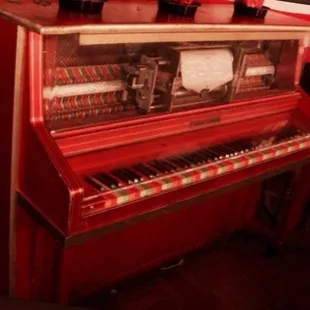Old player piano. Adds to the pub feel.