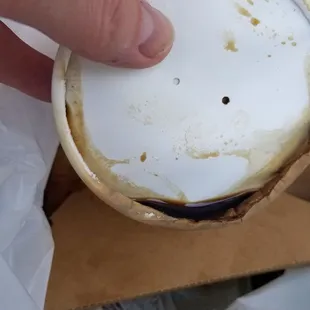 a person holding a cup of coffee