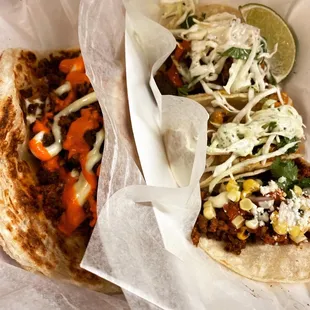 two tacos with toppings