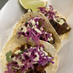 three tacos with cabbage slaw