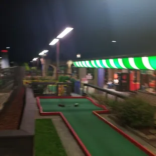 Night time mini golf. Sorry for the poor quality.