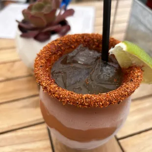 "Ancho Business " mescal and pineapple juice with lime and ancho chili powder around the rim.  Great drink. So good, I had two!