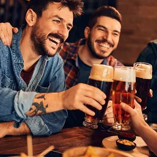 a group of friends enjoying a beer together