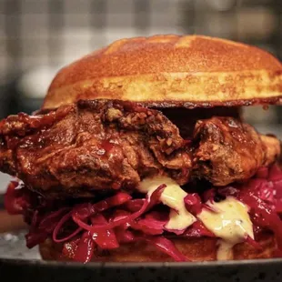 a fried chicken sandwich with red cabbage