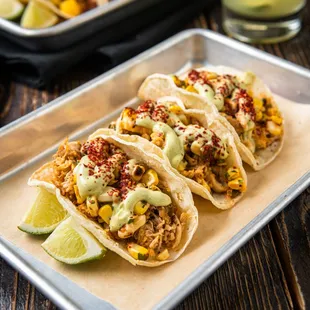 SMOKY CHICKEN TACO Mashed Avocado, Grilled Corn and Poblano Salsa, Cilantro