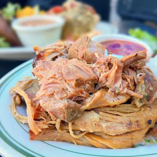 Pernil Asado: Slow-roasted pork marinated w/ garlic, oregano | $16.50