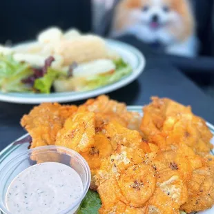 Tostones: Fried, pressed green plantains w/ salsa rosa &amp; Yuca Al Mojo: Cassava root w/ garlic, olive oil mojo, onions | $8.50 each