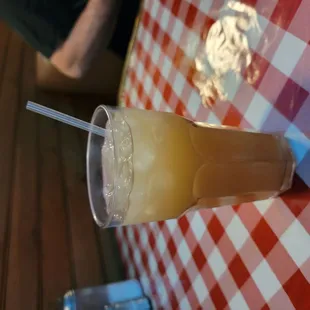 a glass of orange juice on a table