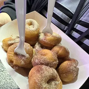 Fresh lightly dusted hot mini donuts - Cinnamon &amp; Sugar. So Bomb!