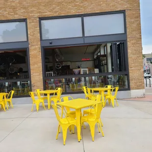 tables and chairs outside a cafe